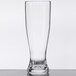 A close-up of a clear GET Tritan plastic pilsner glass with a clear bottom.