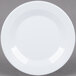 A white Minski melamine plate with a textured rim.