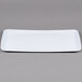 A white rectangular melamine display tray with a Coralline pattern on the border.