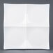 A white square CAC porcelain tasting plate with four divided sections.