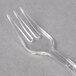 A clear plastic WNA Comet Petites tasting fork.