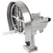 A silver Nemco Easy Slicer with a circular metal wheel and a white handle.