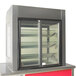 A Delfield drop-in glass door refrigerated merchandiser on a counter.