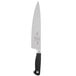 A Mercer Culinary Genesis chef knife with a black handle and silver blade.