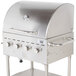 A stainless steel Backyard Pro roll dome lid on a stainless steel grill with knobs.