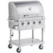 A stainless steel Backyard Pro outdoor grill with three burners and a stainless steel top and wheels.