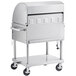 A stainless steel Backyard Pro barbecue on wheels.