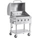 A stainless steel Backyard Pro outdoor grill with a vinyl cover.