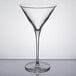 A clear glass martini glass with a long stem.