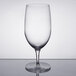 A clear wine goblet with a clear stem and base and a white rim.