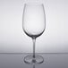 A Reserve by Libbey wine glass on a reflective surface.