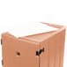 A beige plastic Cambro cart with a piece of paper on top.