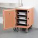 A beige Cambro mobile cart with trays inside.
