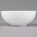 A close-up of a 10 Strawberry Street Izabel Lam Pond white bone china cereal bowl with a white rim.
