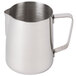 A silver stainless steel milk pitcher with a handle.