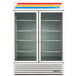 A close-up of a True white glass door refrigerator with shelves inside.