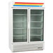 A white True refrigerated glass door merchandiser with shelves inside.