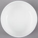 A white 10 Strawberry Street bone china bouillon bowl with a white rim on a gray surface.