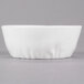A close up of a 10 Strawberry Street bright white porcelain pinch bowl with a small rim.