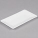 A 10 Strawberry Street white rectangular bone china plate on a gray surface.