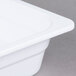 A close-up of a white Thunder Group melamine food pan.