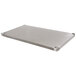 A galvanized steel undershelf with holes designed for an Advance Tabco work table.