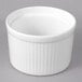 A white porcelain fluted ramekin with a ribbed rim.