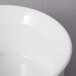 A close-up of a 10 Strawberry Street Whittier white porcelain fluted ramekin.