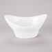 A white bowl with a curved edge on a white background.