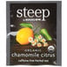 A package of Steep By Bigelow Organic Chamomile Citrus Herbal Tea Bags on a table with lemons and flowers.