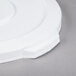 A white plastic Continental lid with a circular edge.