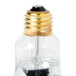 A Nemco ceiling mount infrared bulb with a gold cap.