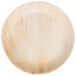 A close up of a TreeVive by EcoChoice 10" compostable round palm leaf plate.