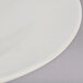 A close up of a Tuxton eggshell white pasta bowl with a white rim.