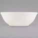 A white Tuxton china nappie bowl.