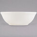 A white Tuxton eggshell china nappie bowl.