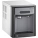A black and gray Follett countertop ice maker and water dispenser with a handle.