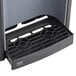 A Follett countertop ice maker and water dispenser with a black drain tray.