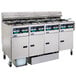 A large Pitco electric fryer system with 2 split pot units, 2 full pot units, and a push button control panel.