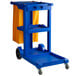 A Lavex blue janitor cart with a yellow bag on white background.