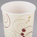 A white Solo poly paper cold cup with a design on it.