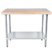 An Advance Tabco wood top work table with a galvanized base and undershelf.