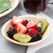 A TreeVive by EcoChoice compostable bowl filled with fruit on a table.