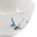 A close-up of a Thunder Group Blue Bamboo melamine rice bowl with a blue and white bamboo design.