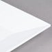 An American Metalcraft white square melamine platter with a white edge.