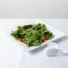 An American Metalcraft white square melamine platter with a salad and fork.