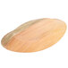 A TreeVive by EcoChoice oval palm leaf tray with a wooden surface.