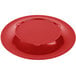 A red Carlisle melamine plate with a wide, circular edge.