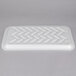 A white styrofoam tray with zigzag lines.