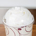 A Solo Ultra Clear plastic lid with a whipped cream on top.